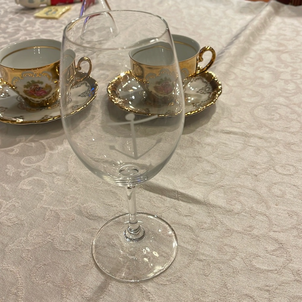 One Riedel glass 7 3/8” tall, 2 1/4” width,signed